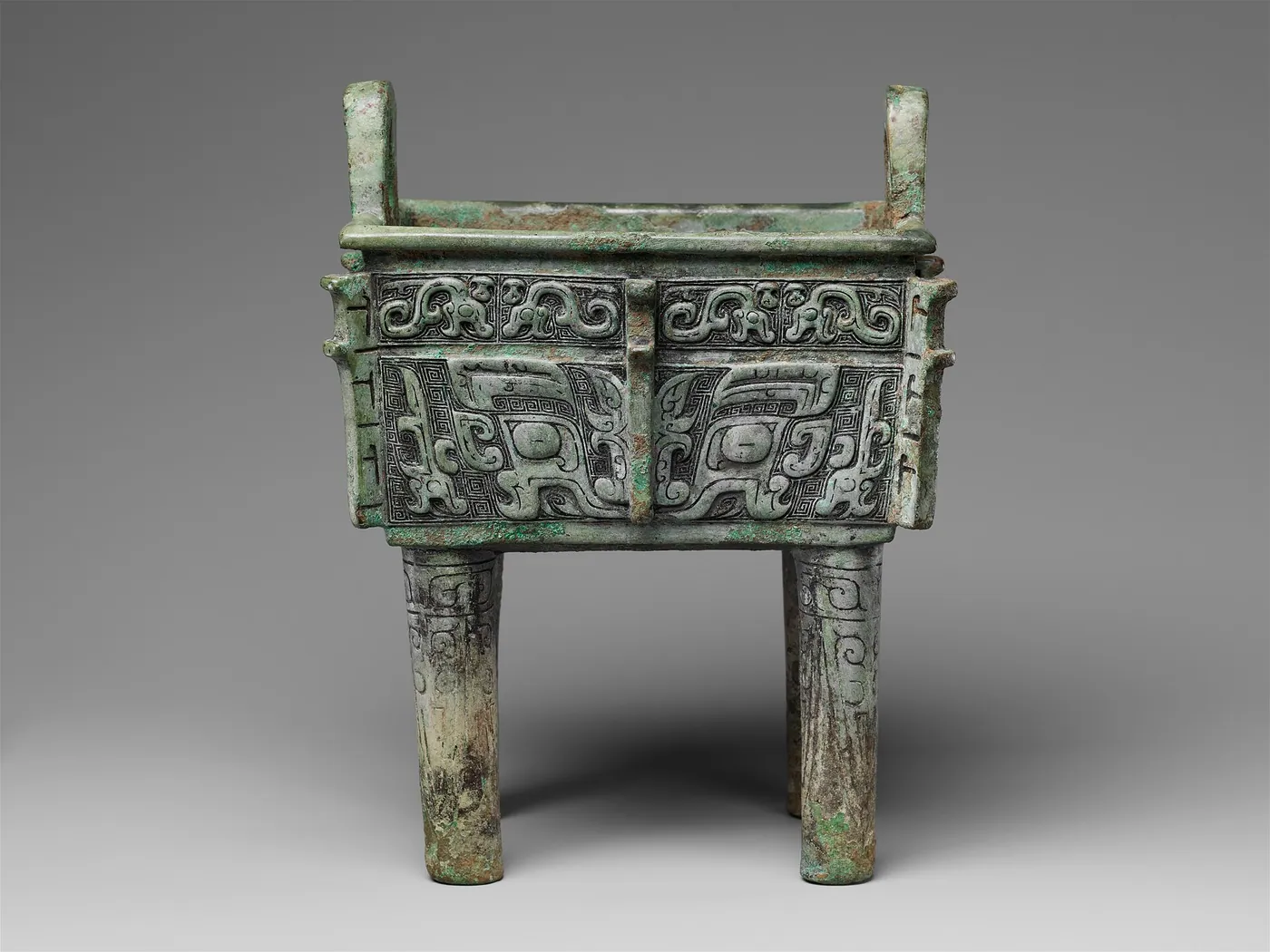 A late Shang bronze rectangular cauldron (fangding), 12th–11th century BCE (Metropolitan Museum of Art), cast by the piece-mould method. West Asian smiths of the same centuries cast figures by the lost-wax method; each technique continued for two thousand years.