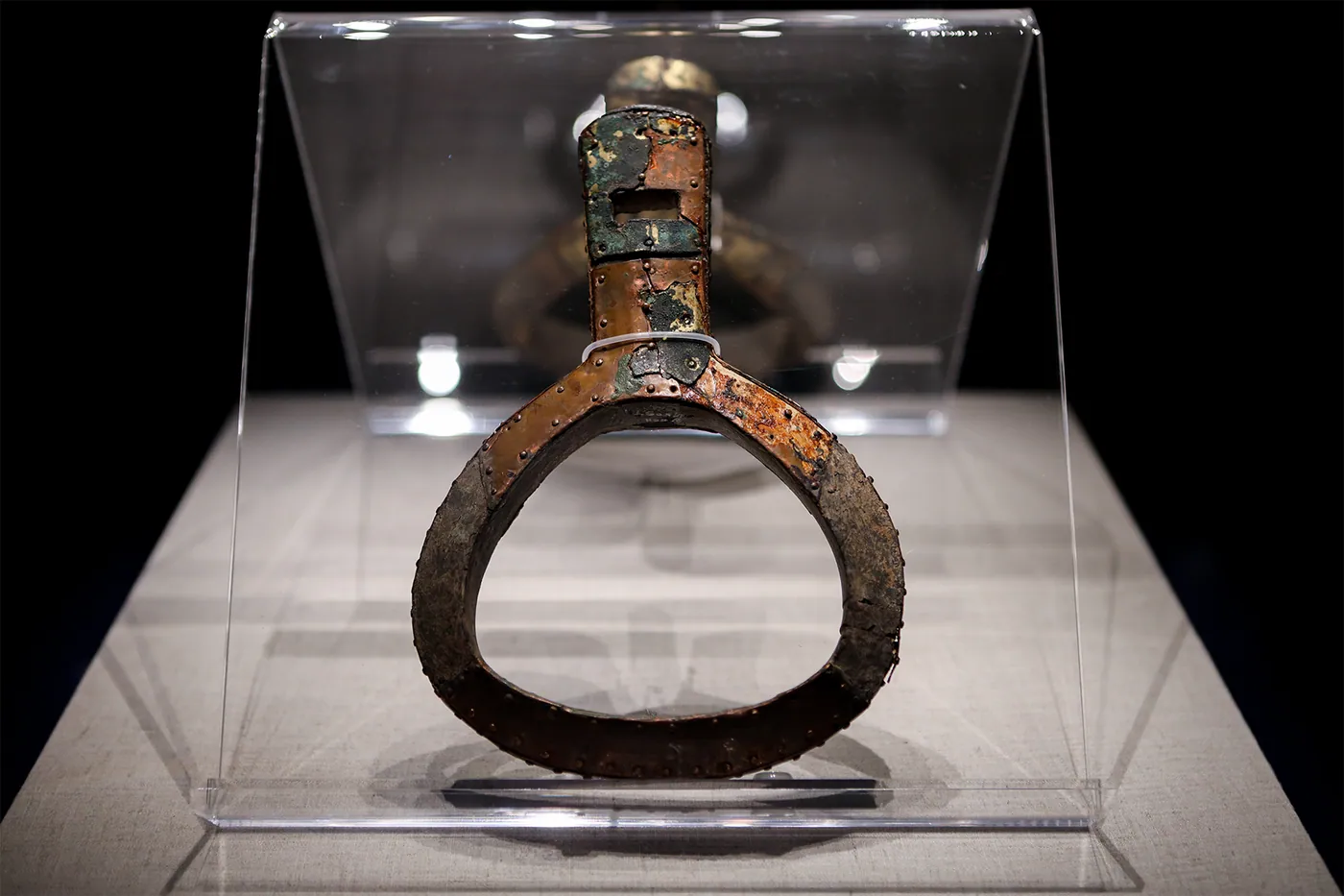 Wooden-cored stirrups sheathed in gilt bronze from the tomb of Feng Sufu at Beipiao, Liaoning (Northern Yan; he died in 415; Liaoning Provincial Museum), among the most securely dated surviving pairs.